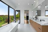 Primary bath with balcony access.