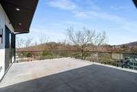 Elevated concrete deck on the upper level.