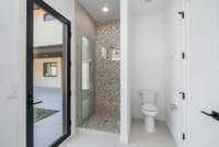 Pool wing shower with direct access to the pool deck.