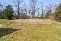 The crest of the hill has a flat shelf for a sport court, fire pit, party barn and more.