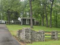 Beautiful stone fence along the front of the property.