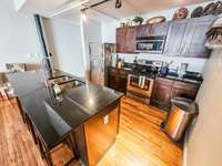 Beautiful original hardwood floors, eating island & stainless appliances.