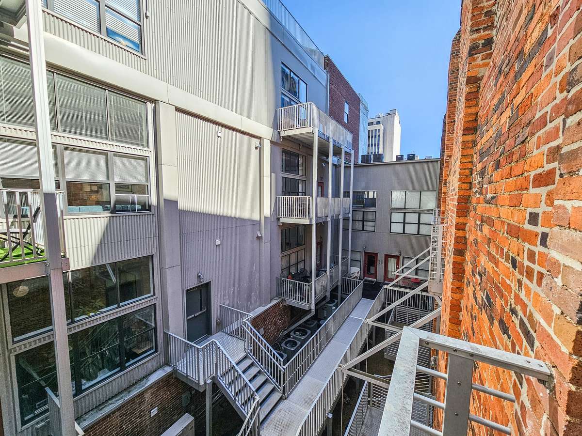 Small balcony outback, shoot of the alley between the condo's.