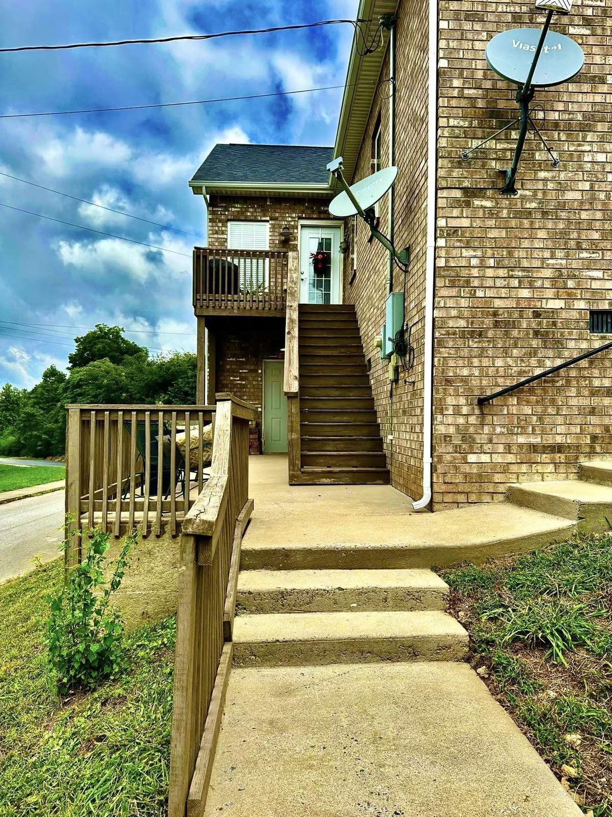 Entrance to the Front Door and Storage Room below. Terraces all feature beautiful views of Flat Creek and Woods with Concrete side walks to stroll along the creek and trough the woods..