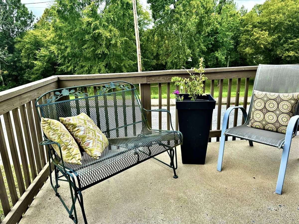 Sitting Area on a Terrace with Flat Creek behind.