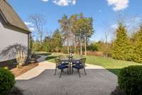 The perfect patio for entertaining around the table or a firepit.