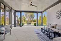 The outdoor living area boasts of a covered patio and uncovered space into the private backyard