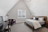 Bedroom 4 feels spacious with the vaulted ceiling and additional closet and bathroom space.