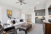 Extra closets and the bar with a refrigerator make the media room perfect for hanging out or can serve as a workout room.
