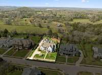 Situated on .66 acre backing to private property protected by trees.