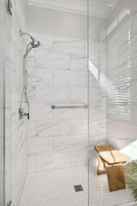 Second bedroom on the main floor featuring a full bath with standup shower.