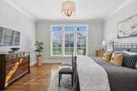 A second bedroom with ensuite on the main floor brings comfort and privacy for guests or family.