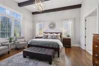 Hardwood floors throughout and an extra seating area gives plenty of space in the primary bedroom.