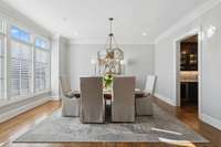 Plenty of light flowing into the dining room right inside the front entrance.