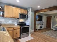 New Electric Range and Microwave.  Enjoy those Refinished Hardwood Floors!