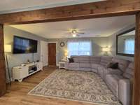 Roomy Living Room with Refinished Original Hardwood Flooring.