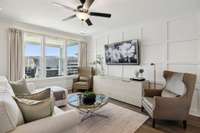 Upgraded wall paneling and window treatments in the living room