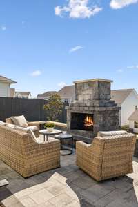 Wood-burning fireplace perfect for summer evenings under the stars