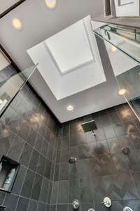 Spa-Inspired Shower with Custom Tile and Sleek Glass Panels + a SKYLIGHT!!