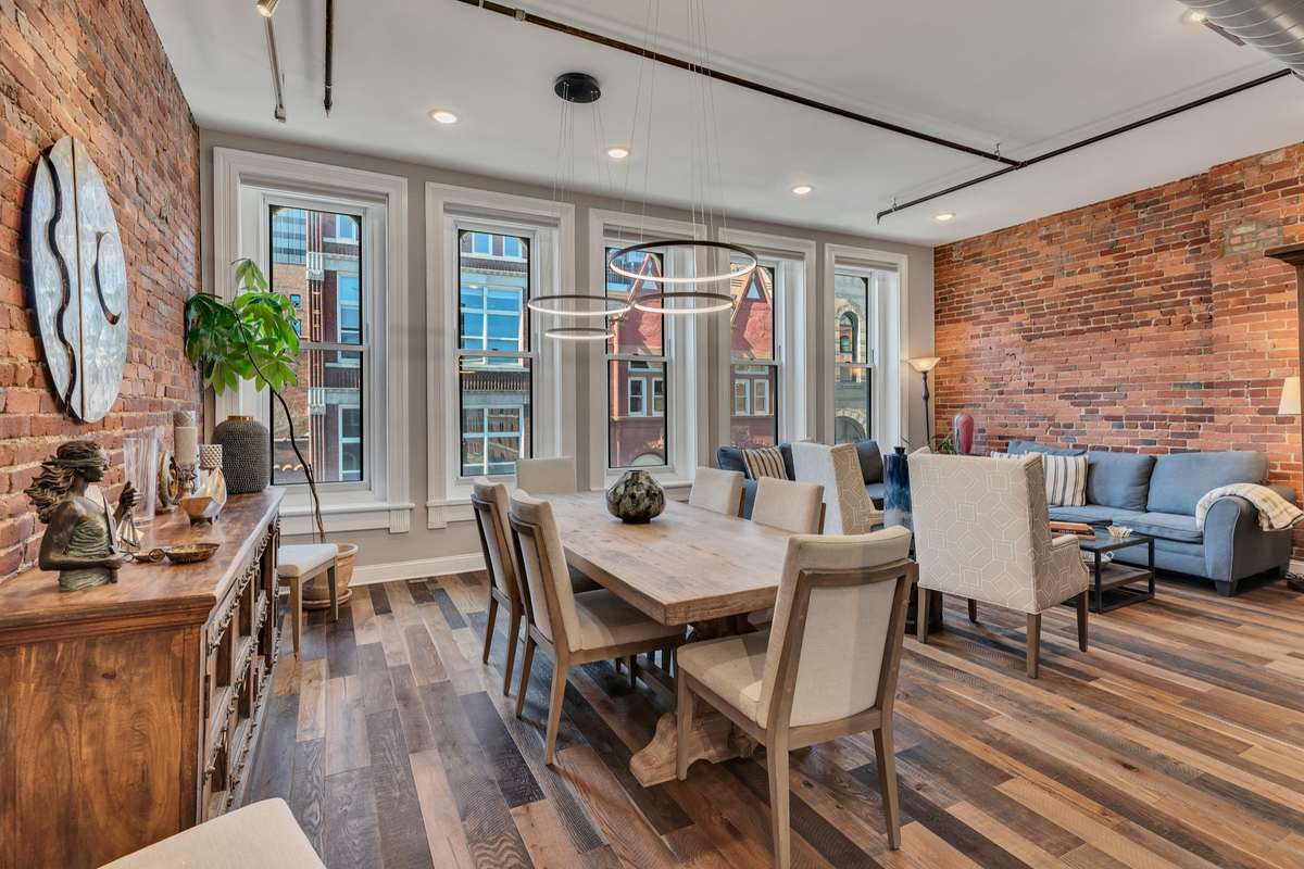 Expansive living area with hardwood floors and soaring ceilings...