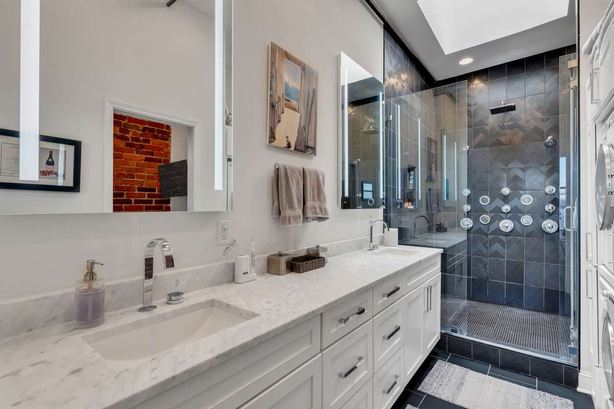 Luxury Finishes in primary bath with separate water closet.