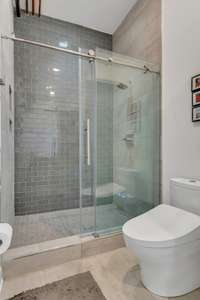Luxury Tiled Shower with Clear Glass Enclosure...