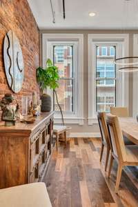 Exposed brick and copper plumbing enhance the loft's character.