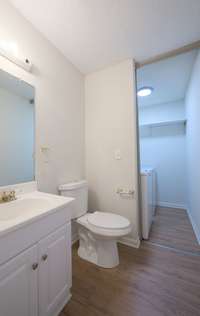Half bathroom with laundry area