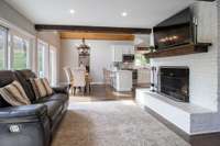 Cozy living area with wood burning fireplace