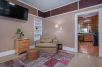 Sitting area in oversized bedroom with built-in shelving