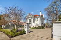 This stately home was built in 1910 and thoughtfully renovated by the current owners. Enter through the William and Merry custom designed electronic gate and fence.
