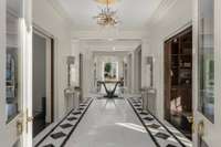 Note the John Richard Designer chandelier with gold leaf medallion.