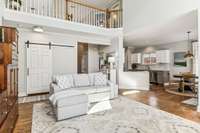 Open floorplan flows to kitchen
