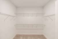 Walk-in closet in primary suite....