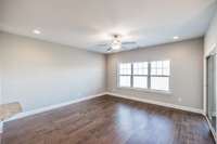 Living area w/ hardwood floors...