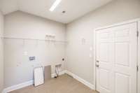 Laundry room going into the garage....
