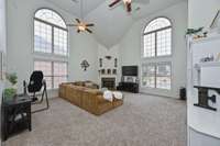 This enormous bonus room is perfect for family movie nights, games or entertaining. Cozy up by the fireplace in the winter and enjoy the light soaring through these floor to ceiling windows