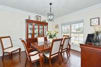 Step inside the front door and to your right, you are greeted by this spacious formal dining room that also connects to the kitchen.
