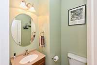 Half bath right around corner from kitchen and den