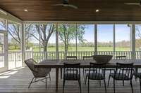 Enjoy outdoor living year-round with a spacious screened-in deck and covered patio—perfect for entertaining or unwinding. Direct access from the main living room and primary suite.