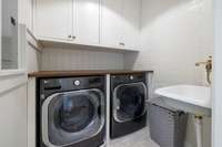 The second floor includes its own laundry area, providing dedicated laundry spaces on each level of the home.