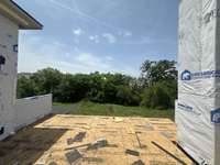Sun Deck off of Bonus Room *this home is under construction Photo taken 5/19/25