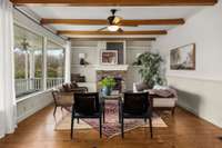 Great Room filled with natural light, high ceilings, and original wood floors.