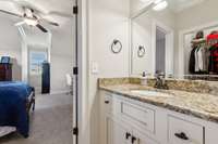Jack/Jill bathroom with private vanities & pocket doors.