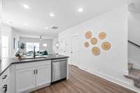 Another view of the kitchen with closet and half bath on far wall