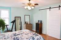 2nd bedroom w/barn door entrance to bathroom.  Handicap accessible.  Bathroom is completely handicap accessible with large door opening, grab bars and accessible shower