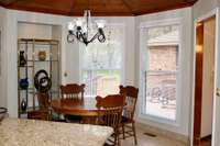 Breakfast nook with large windows.  You can sip your coffee and watch the wildlife every morning right from your dining table.