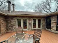 The deck has new double French doors from family room to the deck