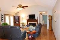 Gas Fireplace in the Gathering Room with vaulted ceilings and gorgeous flooring