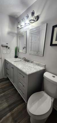 Main Bath is Between Bedroom #2 and #3 and has a Combo Shower/Tub